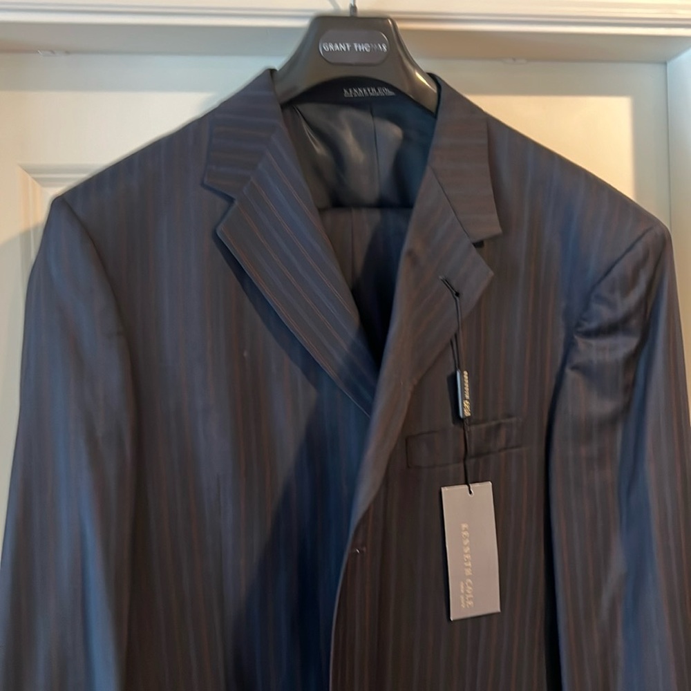3 button suit. Brand new. Never altered